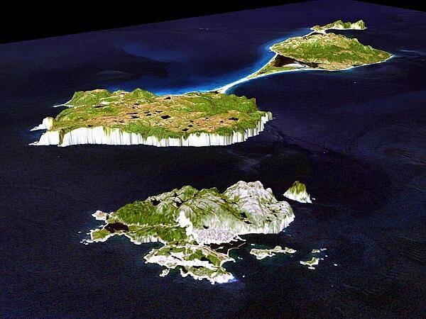 A 3-D perspective view of Miquelon (background) and Saint Pierre Islands (forefront), located south of Newfoundland, Canada. These islands, along with five smaller islands, are a self-governing territory of France. North is in the top right corner of the image. Image courtesy of NASA.