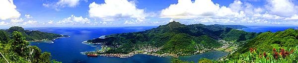 Located on opposite sides of Pago Pago Harbor, Matafao Peak (center) and Rainmaker Mountain far left) are two of the five great masses of volcanic rock that were extruded as molten magma during the major episodes of volcanism that created Tutuila island. Matafao Peak is the highest mountain on the island. Photo courtesy of the US National Park Service.