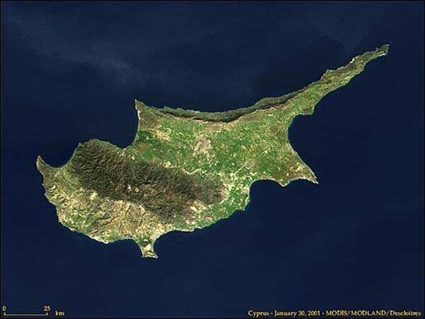 Satellite photo of the island of Cyprus. The Dhekelia Sovereign Base Area is located north of the southeastern indent (Larnaca Bay). Image courtesy of NASA.