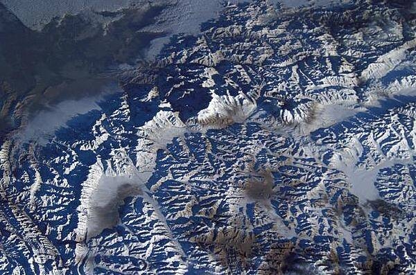 This view shows K-2 Mountain (upper center) in Pakistan, the world's second highest peak, as seen from the International Space Station. The mountain (8,611 m; 28,251 ft high) is sometimes referred to as Savage Mountain, because of the difficulty of its ascent and the many lives lost in attempting its climb. Image courtesy of NASA.