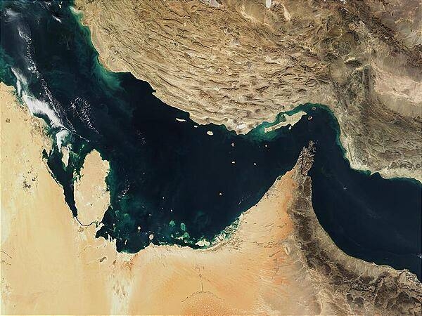 The Persian Gulf (left) and the Gulf of Oman (right) were once the site of a rift, an area where two plates of the earth&apos;s crust pulled apart from each other. The Indian Ocean filled in the widening gap between the two plates. Over time, the process reversed, and about 20 million years ago, the gulfs began to close up. The ongoing collision of the two continental plates resulted in Iran&apos;s mountainous terrain (top) and its periodic earthquakes. 

Several Gulf States are visible across the eastern Arabian Peninsula that makes up the lower part of the image. In addition to Saudi Arabia across the bottom, the islands of Bahrain in the left center lie next to the prominent peninsula that makes up Qatar. Further to the right are various offshore islands of the United Arab Emirates; most of the darker area to the right makes up Oman. Photo courtesy of NASA.