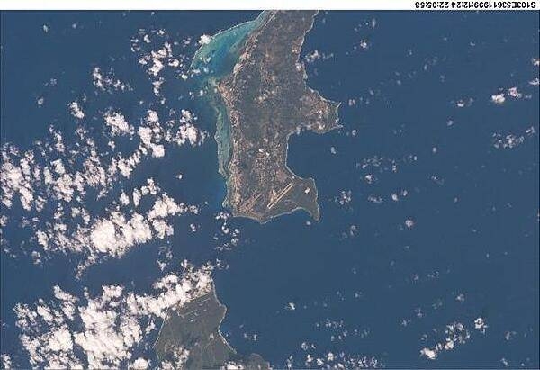 A view of two of the Mariana Islands as seen from the space shuttle - Saipan (to the north) and Tinian. Image courtesy of NASA.