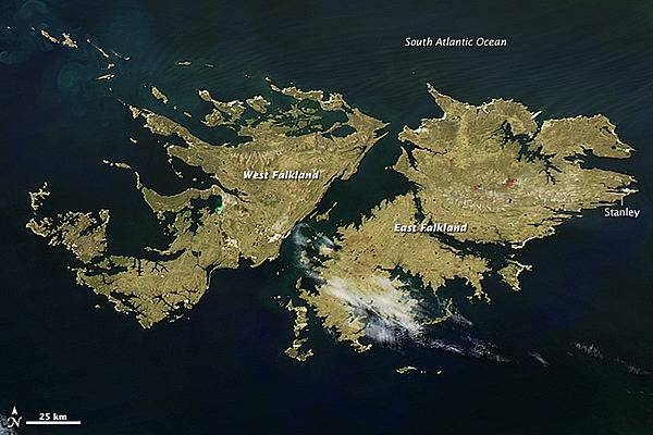 The Falkland Islands lie about 600 km (400 mi) east of Argentina and 1,350 km (850 mi) north of the Antarctic Circle. There are 778 islands in this territory of the United Kingdom, but just two large islands - East Falkland and West Falkland - comprise the bulk of the Connecticut-sized landmass.

Few trees grow on the islands. Instead, grassland and heath - which is widely used as pastureland for sheep and cattle - dominate the landscape. The islands are home to nearly 500,000 sheep and 5,000 cattle, and the animals far outnumber the 2,600 permanent human residents. About 80% of the population resides in the capital of Stanley.

Farmers often burn pastureland in the early spring to encourage growth. When ewes and lambs are born, they move the young animals to recently-burned areas to graze. This satellite image captures a glimpse of a few agricultural fires west of Stanley. Image courtesy of NASA.