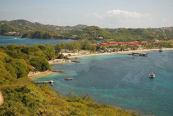 Pigeon Island is a former islet (180,000 sq m; 44 acres) off the north point of Saint Lucia joined to the mainland in 1972 by a man-made causeway - built from the town of Gros Islet with soil excavated to form the Rodney Bay Marina. This view is from the top of Pigeon Island looking back toward the causeway and the main island.