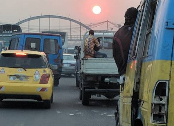 Traffic on the way to the airport in Kinshasa. Only about 2% of the DRC's roads are paved. There are several on-going projects devoted to improvement and maintenance of DRC’s infrastructure.