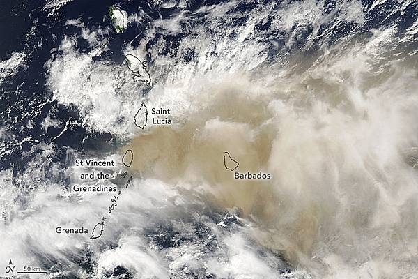 Beginning on 9 April 2021, eruptions at La Soufrière volcano on the island of Saint Vincent propelled ash and gas high into the air over the Caribbean islands of Saint Vincent and Barbados. Winds carried much of the ash and gas east from Saint Vincent. On the afternoon of 10 April, the Moderate Resolution Imaging Spectroradiometer (MODIS) on NASA’s Aqua satellite acquired this image showing ash reaching Barbados, 190 km (120 mi) away. Clouds (white) are also abundant in this view. Photo courtesy of NASA.