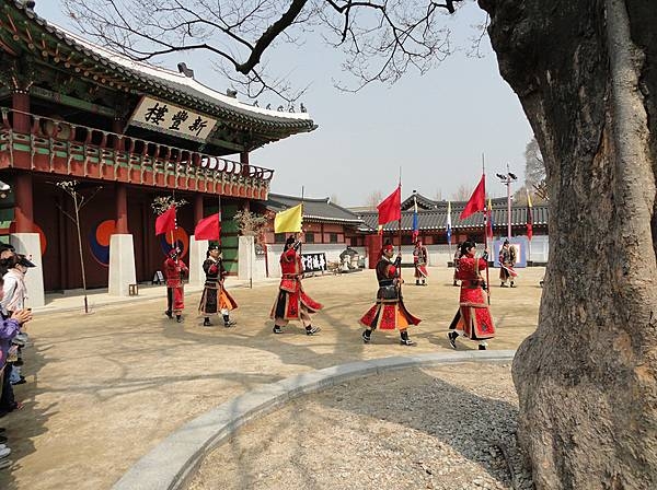 Colorful procession in Hwaseong Fortress or Suwon Hwaseong. Built between 1794 and 1796, the fortification surrounds the center of Suwon, the provincial capital of Gyeonggi-do, in South Korea. Located 30 km (19 mi) south of Seoul and enclosing much of central Suwon, the fortress includes a palace, Haenggung. The fortress and enclosed palace were designated as a World Heritage site by UNESCO in 1997.