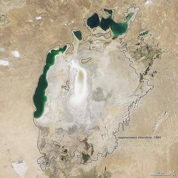Throughout the first half of the 20th century, the Aral Sea was the world&apos;s fourth-largest lake. In the 1960s, the Soviet Union began a massive irrigation project in what are now Kazakhstan, Uzbekistan, and Turkmenistan, diverting water from the rivers that feed the Aral Sea to irrigate farmland. As its water levels dropped, the lake began splitting into smaller pieces: the Northern (Small) Aral Sea and the Southern (Large) Aral Sea. The Southern Aral Sea further split into eastern and western lobes. In August 2009 when this photo was taken, the Northern Aral Sea (upper right) still appeared healthy, the Southern Aral Sea consisted of two isolated water bodies: an irregular oval shape directly southwest of the Northern Aral Sea, and the long, thin remainder of the Southern Aral Sea&apos;s far western lobe. Much of what finally doomed the Southern Aral Sea was an attempt to save its neighbor to the north. In 2005, Kazakhstan built the Kok-Aral Dam between the lake&apos;s northern and southern portions to preserve water levels in the north. The Northern Aral Sea actually exceeded expectations with the speed of its recovery, but the dam ended prospects for a recovery of the Southern Aral Sea, which some authorities already regarded as beyond help. Lake sediments from this depleted water body have provided ample material for frequent dust storms. Image courtesy of NASA.