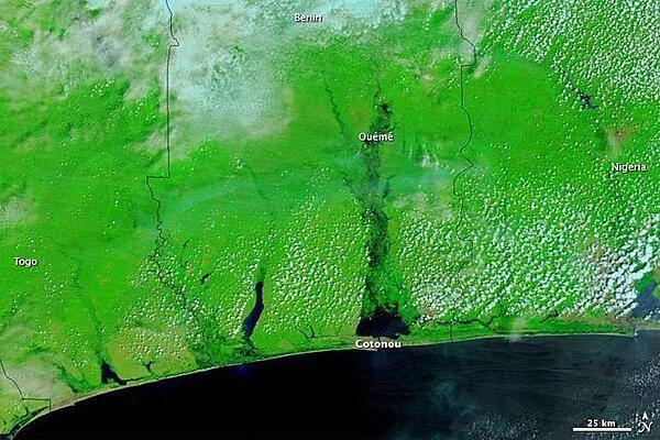 Heavy rains flooded parts of West and Central Africa in the rainy season of 2010, and among the hardest-hit countries was Benin. The image, which shows the coast of Benin on 22 October 2010, uses a combination of infrared and visible light to increase the contrast between water and land. Water ranges in color from electric blue to navy. Vegetation appears bright green. Clouds range in color from off-white to pale blue-green. Photo courtesy of NASA.