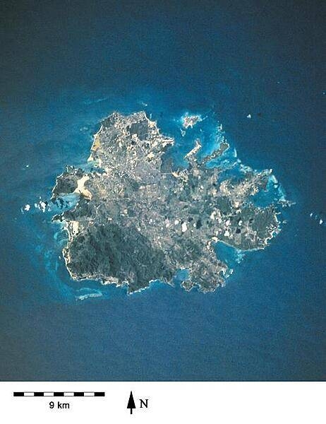 A closer view of the island of Antigua shows severely eroded volcanic remnants along its forested southwestern quadrant. Although Antigua receives approximately 100 cm (40 in) of precipitation annually, wide fluctuations in rainfall amounts occasionally create serious water shortages, especially for the agricultural industry. St. John&apos;s, the country&apos;s capital, is located along the northwest coast, adjacent to one of the island&apos;s many natural harbors. More than half of the country&apos;s population lives in the St. John&apos;s area. Image courtesy of NASA.