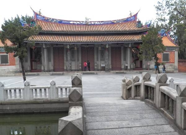The Confucius Temple is located in the Datong District of Taipei. The original temple, built in 1879, was destroyed during the Japanese era (1895-1945). The temple was rebuilt in 1930, but during WW II traditional Chinese ceremonies were suspended by the Japanese until Taiwan was handed back to the Republic of China in 1945. The temple is modeled after the original Confucius Temple in Qufu, Shandong. Among the Confucius temples in Taiwan, Taipei's is the only one adorned with southern Fujian-style ceramic applique. The main hall of the temple contains a black plaque with a quote by Chiang Kai-shek in gold lettering that reads: "Educate without Discrimination."