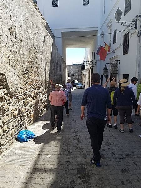 Narrow street in Tangier leading from the Kasbah. In Morocco, the Arabic word "kasbah" refers to multiple buildings in a keep, a citadel, or several structures behind a defensive wall.