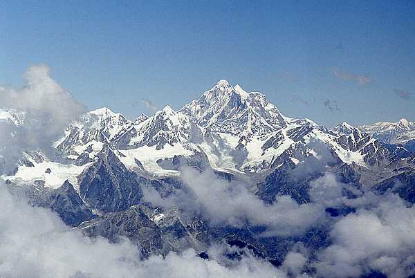 Aerial view of Mount Everest on a clear day. The mountain falls on the Nepal-China border and is shared by both countries.