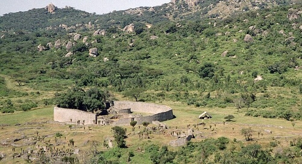 Zimbabwe takes its name from the Kingdom of Zimbabwe (13th-15th centuries) and its capital, Great Zimbabwe (pictured). Built largely of stone by the Shona people, this 7.22 sq km (2.79 sq mi) city is believed to have housed the royal palace and was home to 18,000 people. The city was abandoned in 1450, possibly due to a decline in trade.