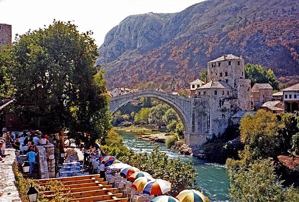 The famous Stari Most (Old Bridge) in Mostar connects the two parts of the city divided by the Neretva River. Built during  the 16th century under Ottoman Sultan Suleiman the Magnificent, the bridge was destroyed in 1993 during the Bosnian War, but was subsequently rebuilt and reopened in 2004. A UNESCO World Heritage Site, the elegant bridge - a model of Balkan Islamic architecture - is the most visited tourist site in the city.