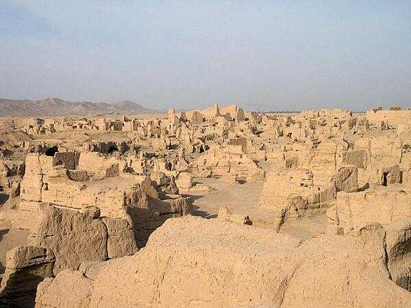 The ruins of Jiaohe in the Yarnaz Valley 10 km (6 mi) west of Turpan, China. An important site along the Silk Road, the city was situated on an islet in the middle of a river, which served as a natural barrier and enabled the city to be built without walls. From 108 B.C. to A.D. 450, it was the capital of the Anterior Jushi Kingdom; later, it became a prefecture capital until the Mongols destroyed it in the 13th century.