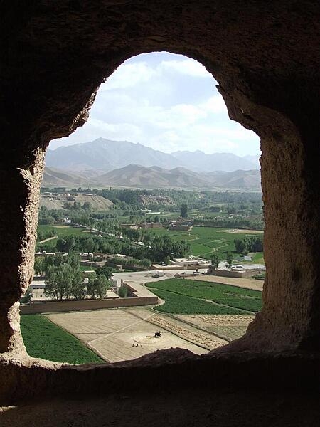 View of surrounding farmlands from within the caves at the &quot;Large Buddha&quot; in Bamyan. The caves were once inhabited by Buddhist monks who left behind a legacy of religious frescoes and paintings, partially destroyed by the fundamentalist Taliban.