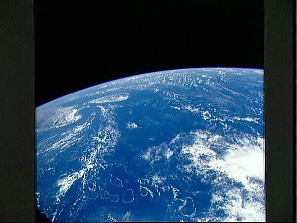 A view over the Indian Ocean as seen from the space shuttle. The bottom portion of the photo shows the complete chain of the atolls that form the Maldive Islands. Off to the left are the southern portion of India, the Palk Strait, and the island of Sri Lanka. Image courtesy of NASA.