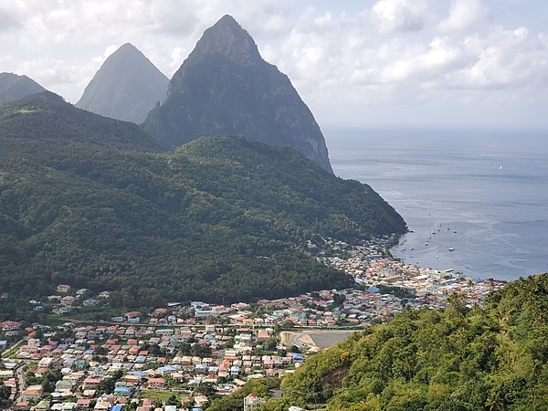 Another view of the Twin Pitons showing more of the town of Soufriere in the foreground.