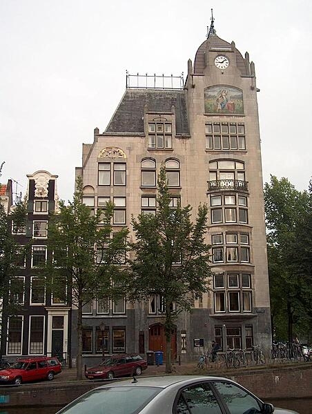 The Astoria building in Amsterdam, built 1904-05, is indicative of a more reserved style of Art-Nouveau (Jugendstil) that came to be known as &quot;New Art&quot; (Nieuwe Kunst). Though difficult to distinguish, typical Art-Nouveau engravings appear in the gray stone around the doorway.