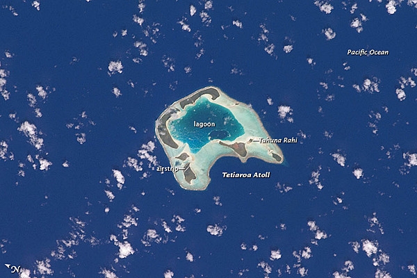 The islets that make up Tetiꞌaroa are located 53 km (33 mi) north of Tahiti and have a total surface area of 6 sq km (2 sq mi); they were once the vacation spot for Tahitian royalty. Image courtesy of NASA.