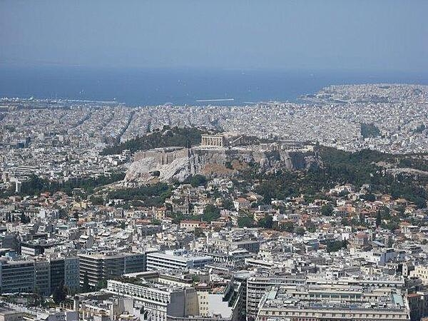 The Acropolis, a flat-topped rock about five hectares (12.4 acres) in area, overlooks the sprawling city of Athens, Greece. Various famous ruins, including the Parthenon, crown its heights.
