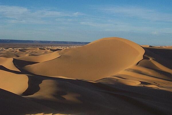 The Sahara Desert covers large parts of Algeria, Chad, Egypt, Libya, Mali, Mauritania, Morocco, Niger, Sudan, and Tunisia, with an area measuring approximately 9,200,000 sq km (3,600,000 sq mi). It is the largest hot desert in the world and the world’s third-largest desert, after Antarctica and the Arctic. The name "Sahara" comes from the Arabic word sahra meaning "desert.”