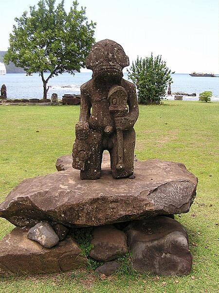 Stone tiki on Nuku Hiva Island in the Iles Marquesas archipelago.