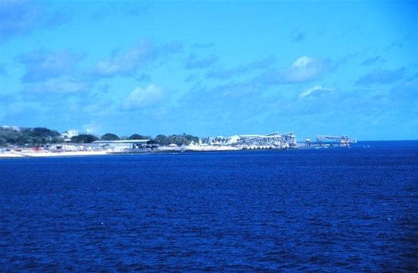 The phosphate ore loading piers on Nauru, which has no natural or protected harbor. Photo courtesy of NOAA/ Lieutenant Mark Boland