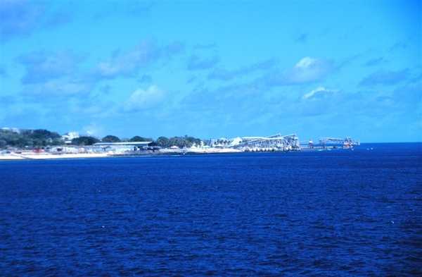 The phosphate ore loading piers on Nauru, which has no natural or protected harbor. Photo courtesy of NOAA/ Lieutenant Mark Boland