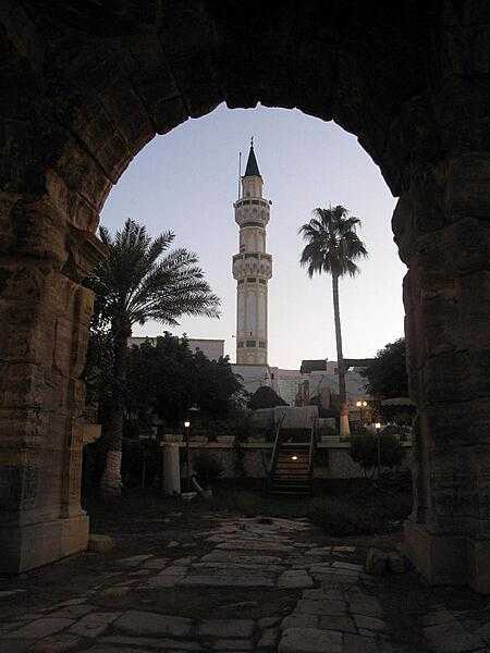 The Arch of Marcus Aurelius is the largest remaining Roman relic in Tripoli, Libya. Seen here framing a local minaret, the monument dates to the second half of the second century A.D.