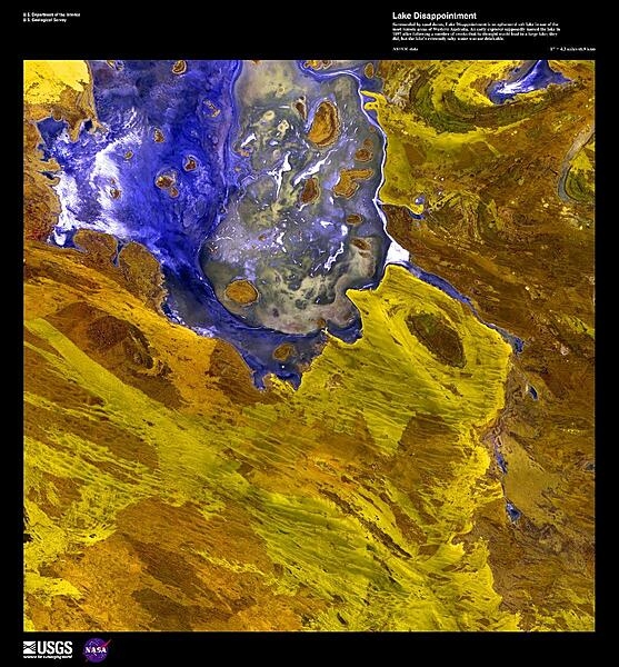 A false-color satellite image  of Lake Disappointment, an ephemeral salt lake surrounded by sand dunes in one of the most remote areas of Western Australia. An early explorer supposedly named the lake in 1897 after following a number of creeks that he thought would lead to a large lake; they did, but the lake&apos;s extremely salty water was not drinkable. Image courtesy of USGS.