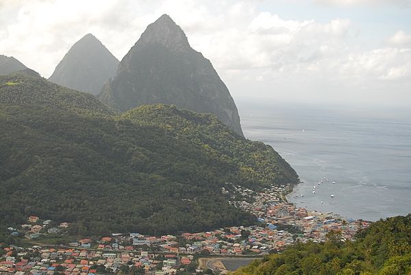 A view of the Twin Pitons - the symbols of the island that also appear on the national flag - with the town of Soufriere in the foreground.