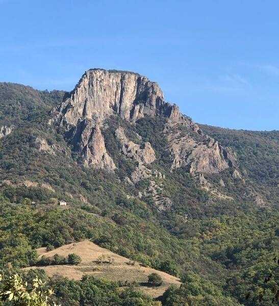Trescovăț, an eroded volcanic plug next to the Danube River, is popular among hikers and climbers and offers impressive views of the river valley. This view is from the Serbian side of the Danube.