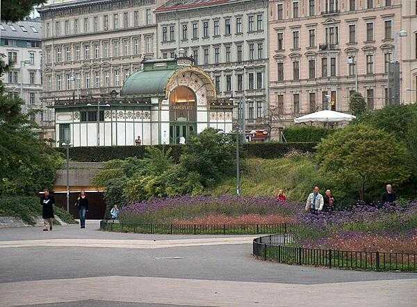 View showing the original aboveground Jugendstil (Art Nouveau) Karlsplatz city rail pavilion in Vienna, Austria, as well as the present-day underground subway entrance. Vienna&apos;s first rail mass-transit system opened in 1898; in 1976, it was integrated into the newly established U-Bahn (metro).