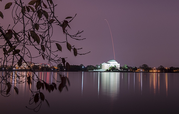 The Thomas Jefferson Memorial in Washington, DC as seen during the early morning hours of 17 November 2018. A flight trail of an Antares rocket - with a Cygnus resupply spacecraft onboard - appears over the memorial. The rocket was launched from NASA's Wallops Flight Facility in Virginia, about 185 km (115 mi) southeast of the capital. The cargo resupply mission to the International Space Station delivered about 3,350 kg (7,400 lb) of scientific research equipment and crew supplies to the orbital laboratory and its crew. Photo Credit: NASA/Aubrey Gemignani.