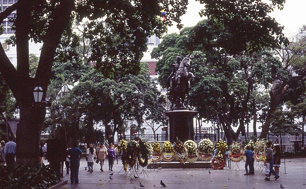 A floral tribute at the statue honoring Simon Bolivar in Caracas' Plaza Bolivar.