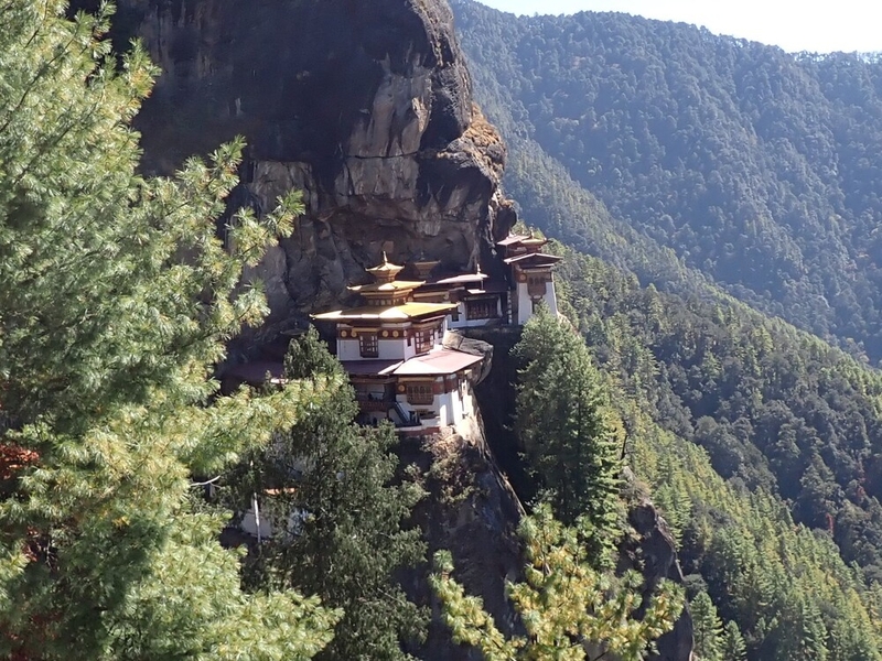 - The Tiger’s Nest Monastery (Taktshang Goemba), Bhutan’s most famous monastery, is built on the side of a cliff 2,950 m (9,678 ft) above the Paro Valley. The Buddhist monastery is built into the rock face and can be accessed from several directions. Guru Rinpoche is credited with bringing Buddhism to Bhutan. According to a legend, the Guru Rinpoche (the second Buddha) founded the monastery after flying from Tibet to Bhutan on the back of a tigress to subdue a demon, Singye Samdrup, who was troubling the valley’s resident. He meditated at the site for three months and anointed it as a monastery. The first monastery was built in 1692, but due to fires and age, the structure was rebuilt numerous times. The most recent reconstruction was completed in 2005, following a fire in 1998.