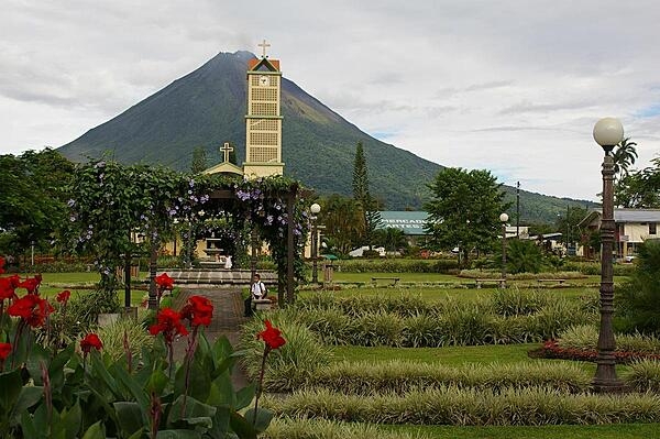 Volcano Arenal, seen here from the town of La Fortuna, was dormant for hundreds of years until it suddenly erupted in 1968. It remained active, off and on, for decades, but has been relatively quiescent since 2010, with only occasional rumbles.