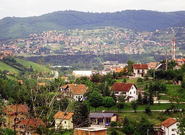 Sarajevo lies in its namesake valley surrounded by the Dinaric Alps; the Miljacka River flows through the city.