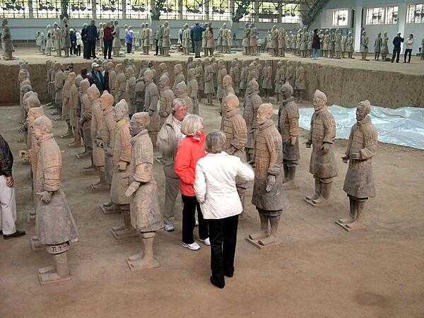 Some of the terra cotta warriors found in the mausoleum of first Chinese Emperor Qin Shi Huang (221-210 B.C.) in Xi'an, China. The tomb, under an earthen pyramid, was discovered in 1974. The ceramic army that accompanied the ruler into the afterlife is estimated to consist of over 8,000 soldiers (each with a unique face), 100 chariots with 400 horses, and 300 cavalry horses.
