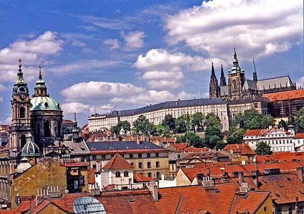 The Hradcany (Castle District) in Prague; its two most prominent features are St. Vitus Cathedral (upper right) and Prague Castle (the long white building, which is one of the largest castles in the world).