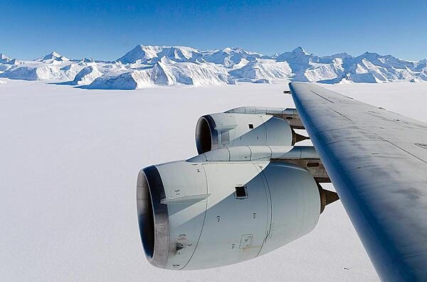 NASA's DC-8 flying laboratory passes Antarctica's tallest peak, Vinson Massif, on 22 October 2012, during a flight over the continent to measure changes in the massive ice sheet and sea ice. The flight was part of NASA's Operation IceBridge, a multi-year airborne campaign to monitor changes in Earth's polar ice caps in both the Antarctic and Arctic. Vinson Massif is located in the Sentinel Range of the Ellsworth Mountains in Antarctica. Photo courtesy of NASA/Michael Studinger.