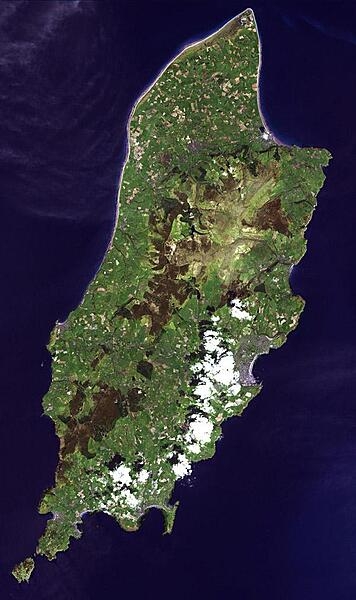 The Isle of Man is a self-governing British Crown Dependency in the Irish Sea between Great Britain and Ireland. The island is not part of the UK, though the head of state is Queen Elizabeth II. Inhabited since 6500 BC, the island was influenced by Gaelic culture, settled by the Norse, was part of Scotland, and came under the feudal overlordship of the English Crown in 1399. The island&apos;s parliament, Tynwald, is one of the oldest ruling bodies in the world, possibly dating to the 10th century. The satellite image, acquired 1 May 2001, covers an area of about 30x50 km (19x31 mi). Photo courtesy of NASA.