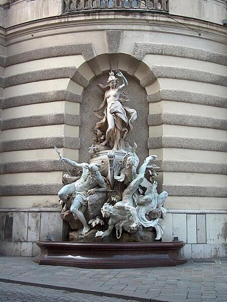 The fountain, Power at Sea, one of two that grace the front of the Michaelertrakt (Michael&apos;s Wing) of the Hofburg (Imperial Palace) in Vienna.