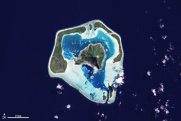 Heart-shaped Maupiti is a small coral atoll with a volcanic island in its midst; the total land area is about 11 sq km (4.2 sq mi). Image courtesy of NASA.