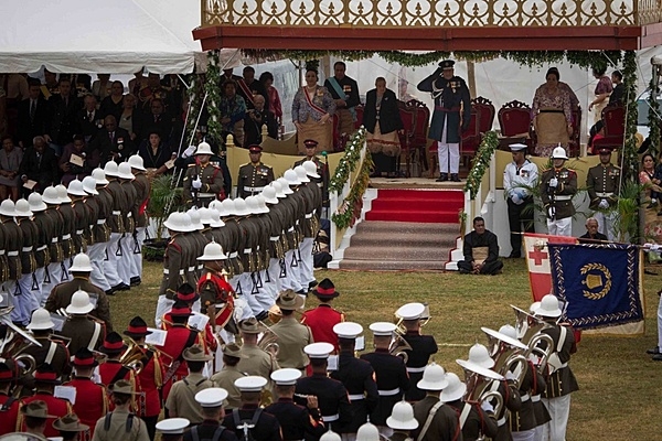 King Tupou VI salutes troops as they pass in review during his coronation celebration in Nuku'alofa, on 6 July 2015. The US Marine Corps Pacific Forces Band performed alongside the Australian Army Band, Tonga's Royal Corps of Musicians, and the New Zealand Army Band in the King's coronation celebration. Photo courtesy of the US Marine Corps/ Cpl. Brittney Vito.