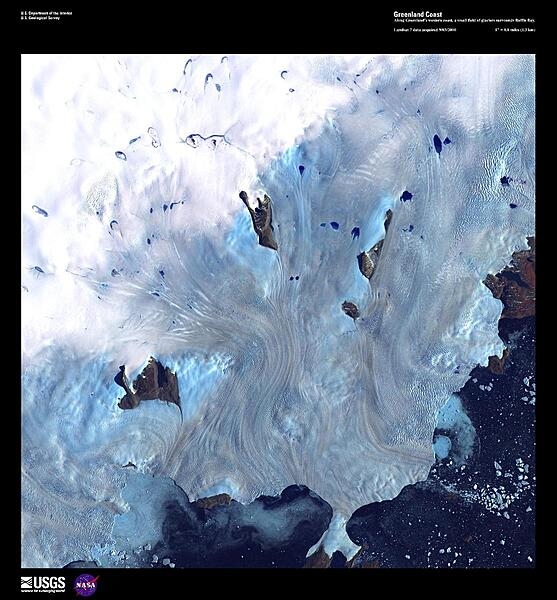 Along Greenland&apos;s western coast, a small field of glaciers empties into Baffin Bay, 80% of which is covered by ice in winter. Calving icebergs may be seen in the lower right of this high-resolution satellite photo. Baffin Bay is only 1,000 m (3,300 ft) deep along the coast. Between May and July a polynya, an area of navigable open water surrounded by sea ice, forms at the northern part of the bay. This polynya, the largest in the Canadian Arctic, is stable in location and has existed for nearly 9,000 years. Image courtesy of USGS.
