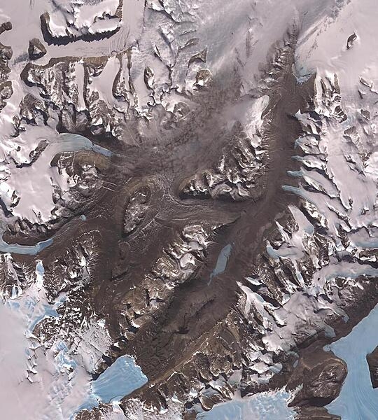 The McMurdo Dry Valleys are a row of valleys west of McMurdo Sound. They are so named because of their extremely low humidity and lack of snow and ice cover. At 4,800 square km (1,900 sq mi), the valleys form the largest ice-free region in Antarctica. This satellite image is courtesy of NASA.