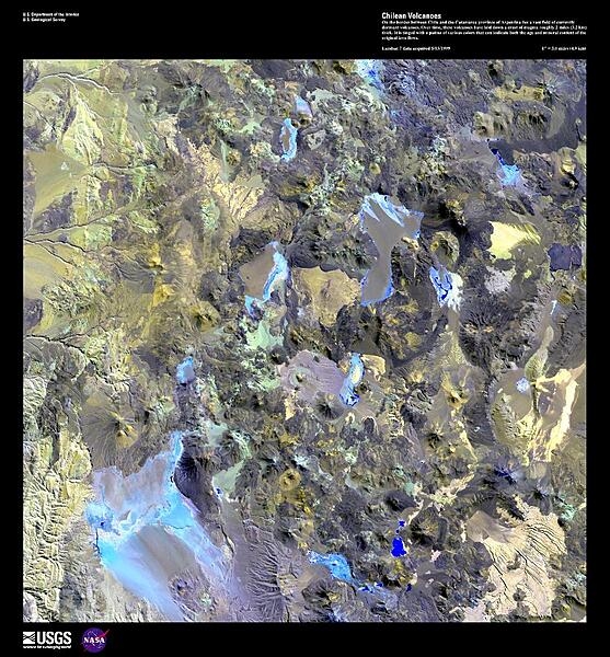 On the border between Chile and the Catamarca province of Argentina lies a vast field of currently dormant volcanoes. Over time, these volcanoes have laid down a crust of magma roughly 3.2 km (2 mi) thick. This enhanced satellite image is tinged with a patina of various colors that can indicate both the age and mineral content of the original lava flows. Some arroyos and alluvial fans may be seen in the upper left portion of the photo. For active volcanoes in Chile and Argentina, see the Natural hazards-volcanism field in the Geography section. Image courtesy of USGS.